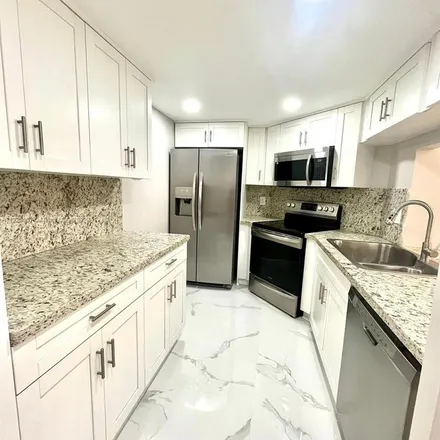 Rent this 3 bed apartment on 852 Northeast 209th Street in Miami-Dade County, FL 33179