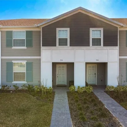 Buy this 5 bed townhouse on Gardenia Lane in Four Corners, FL 33897