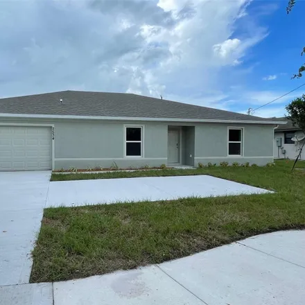 Rent this 4 bed house on 2534 Southeast Floresta Drive in Port Saint Lucie, FL 34984