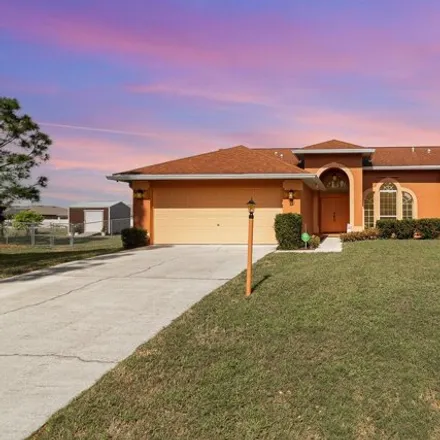 Buy this 3 bed house on 861 Quanah Street Southeast in Palm Bay, FL 32909