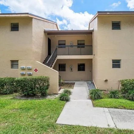 Buy this 2 bed condo on Cocoplum Circle in Coconut Creek, FL