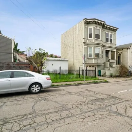 Rent this 4 bed house on 963 21st Street in Oakland, CA 94617