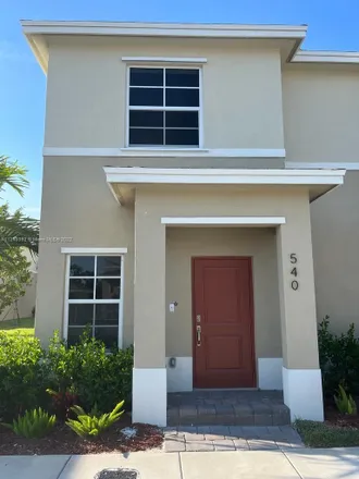 Rent this 2 bed townhouse on Northeast 4th Street in Florida City, FL 33034