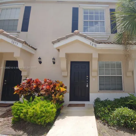 Rent this 2 bed townhouse on 5071 Palmbrooke Circle in West Palm Beach, FL 33417