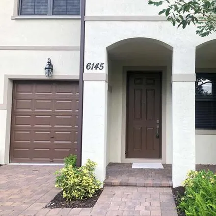 Rent this 3 bed townhouse on 6145 Bangalow Dr