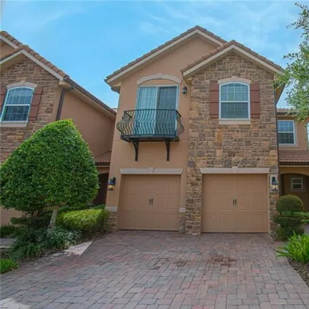 Rent this 4 bed townhouse on 10665 Belfry Circle in Orange County, FL 32832