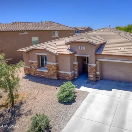 Buy this 4 bed house on 12295 North Wind Runner Parkway in Marana, AZ 85658