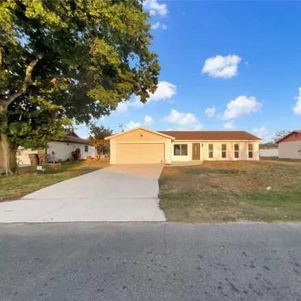 Buy this 4 bed house on 212 East Cedarwood Circle in Buenaventura Lakes, FL 34743