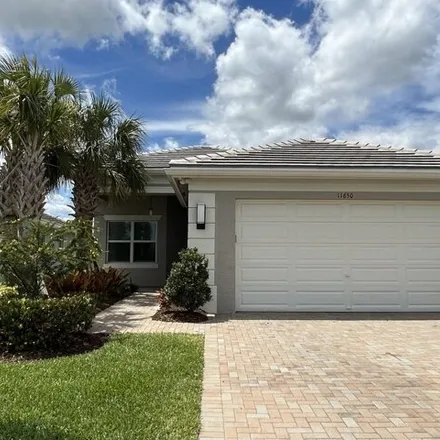 Rent this 4 bed house on Southwest Moon River Way in Port Saint Lucie, FL 34987