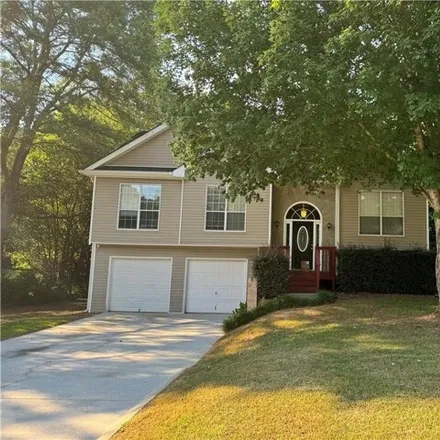 Buy this 4 bed house on 30 Windsong Dr in Covington, Georgia