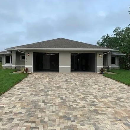 Buy this 6 bed house on 10141 And 10143 Amicola St in Port Charlotte, Florida
