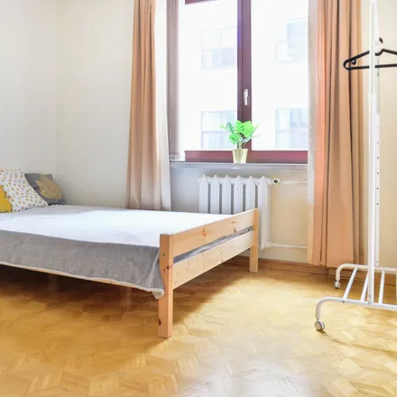 Rent this 4 bed room on Nowogrodzka 62B in 02-002 Warsaw, Poland