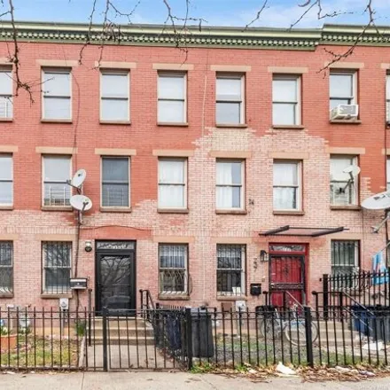 Buy this 4 bed townhouse on 235A Hart Street in New York, NY 11206