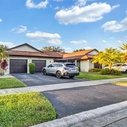 Buy this 2 bed house on Colony West Golf Club - Glades Course in 6800 North Pine Island Road, Tamarac