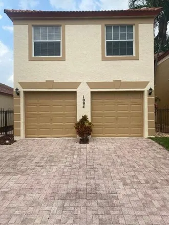 Buy this 3 bed townhouse on Via Jardin in Riviera Beach, FL 33318