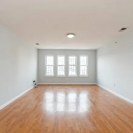 Rent this 3 bed apartment on 141 Woodside Place in Newark, NJ 07104