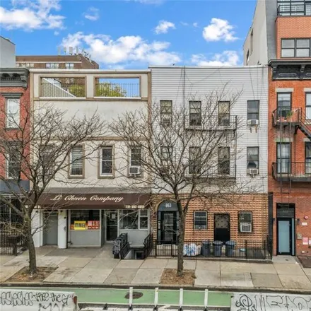 Buy this 7 bed house on 863 Grand Street in New York, NY 11211