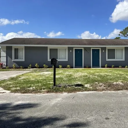 Rent this 2 bed house on 5068 Eastwood Drive in Lakewood Park, FL 34951