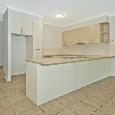 Rent this 4 bed apartment on Serenade Drive in Coomera QLD, Australia