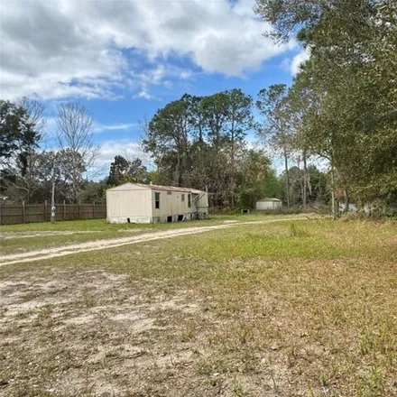 Buy this studio apartment on 11804 CR 464 in Marion County, FL 32179