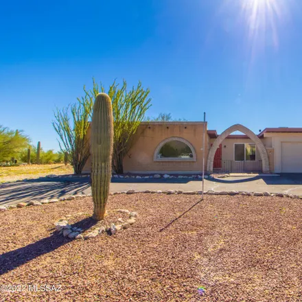 Buy this 4 bed house on 9126 East Chof Ovi Drive in Pima County, AZ 85749