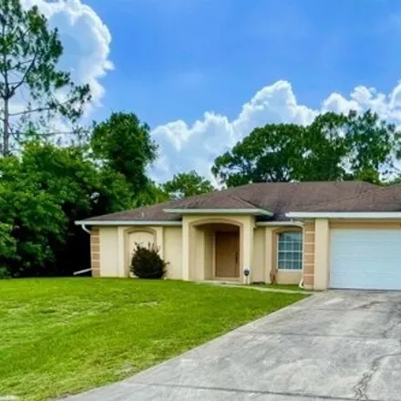 Buy this 3 bed house on 1849 Tomaso in Lehigh Acres, FL 33972