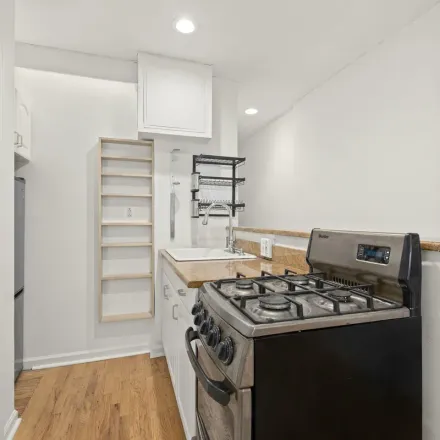 Rent this 2 bed townhouse on 112 Christopher Street in New York, NY 10014