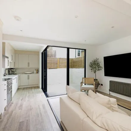 Buy this 3 bed townhouse on Orbain Road in London, SW6 7JZ