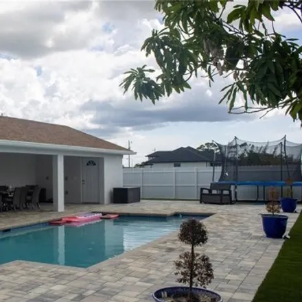Buy this 4 bed house on 1947 Northwest 15th Terrace in Cape Coral, FL 33993