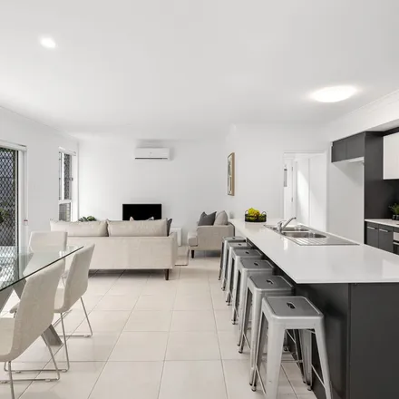 Rent this 4 bed apartment on Tristania Street in Cornubia QLD 4130, Australia