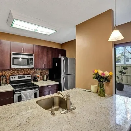 Buy this 2 bed townhouse on 3545 Cocoplum Circle in Coconut Creek, FL 33063