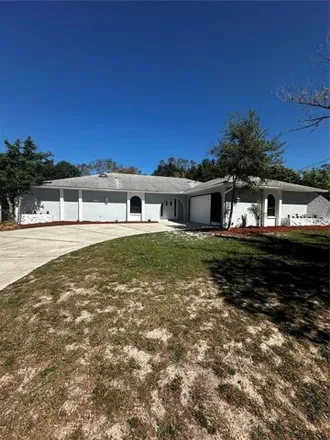 Buy this 3 bed house on 10241 Carrin Road in Spring Hill, FL 34608