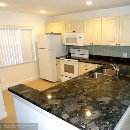 Rent this 2 bed apartment on 7400 Champagne Place in Palm Beach County, FL 33433