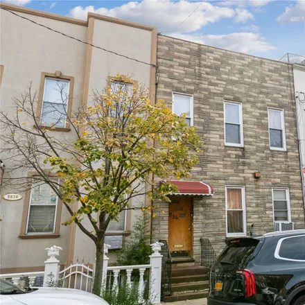 Buy this 5 bed townhouse on 59-36 Woodbine Street in New York, NY 11385