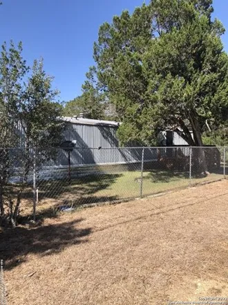 Buy this studio apartment on Lake Medina Shores Community Pool in 7100 Whartons Dock Road, Bandera County