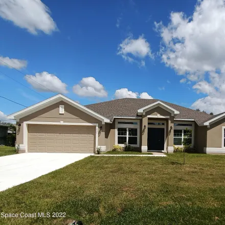 Buy this 4 bed house on 407 Americana Boulevard Northwest in Palm Bay, FL 32907