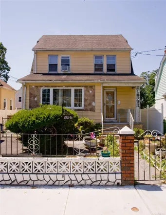 Buy this 4 bed house on 223-2 109th Avenue in New York, NY 11429