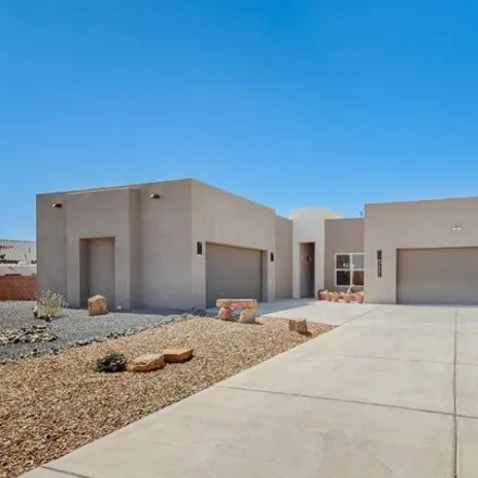 Buy this 4 bed house on 3581 Deledda Road Northeast in Rio Rancho, NM 87144