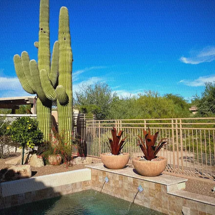 Buy this 2 bed house on 21679 North 77th Place in Scottsdale, AZ 85255