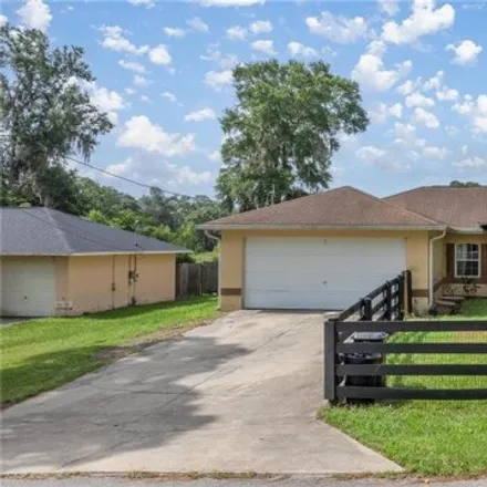 Buy this 3 bed house on 5840 NW 56th Pl in Ocala, Florida