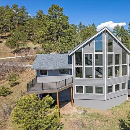 Buy this 4 bed house on 7268 Sourdough Drive in Jefferson County, CO 80465