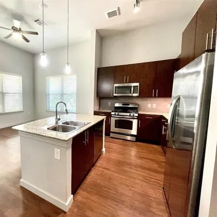 Rent this 3 bed apartment on 2400 McCue Road in Houston, TX 77056
