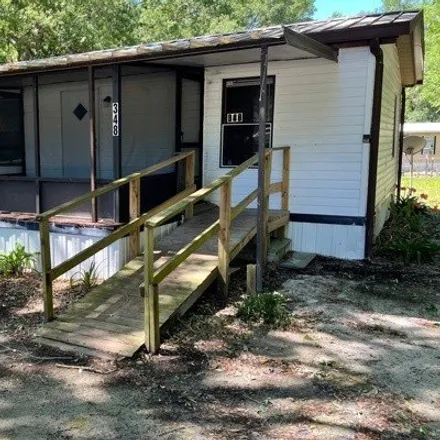Buy this studio apartment on 348 Southwest Woodgate Terrace in Lake City, FL 32024