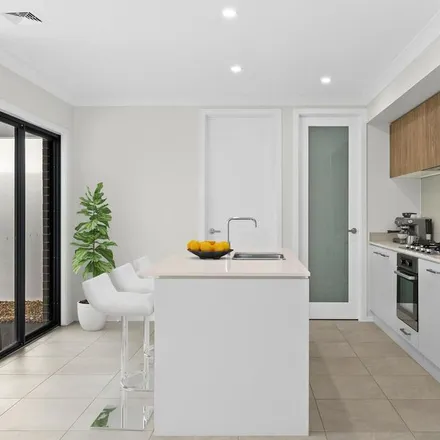 Rent this 3 bed apartment on 55 Tonkin Way in Oran Park NSW 2570, Australia