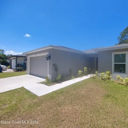 Rent this 4 bed house on 734 Scott Avenue Southwest in Palm Bay, FL 32908