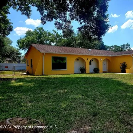 Rent this 3 bed house on 2270 Canfield Drive in Spring Hill, FL 34609