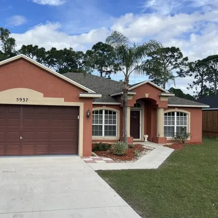 Buy this 4 bed house on 5917 Northwest Baynard Drive in Port Saint Lucie, FL 34986