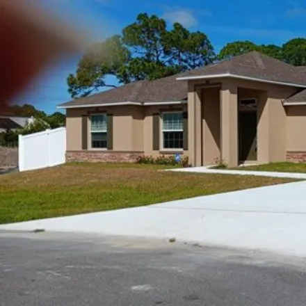 Rent this 4 bed house on 1301 Silva Street Southeast in Palm Bay, FL 32909