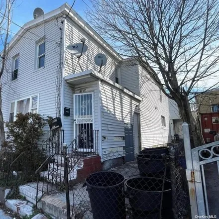 Buy this 8 bed house on 91-13 77th Street in New York, NY 11421