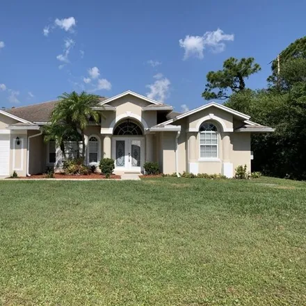 Rent this 3 bed house on 2424 Southwest Whitehorse Street in Port Saint Lucie, FL 34984